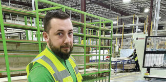 
			
				                                Damian Gawronkiewicz, head of manufacturing operations at Wren Kitchens, holds one of the many styles of kitchen cabinetry the company manufactures in two large buildings in the Hanover Industrial Estates in Hanover Township and Sugar Notch and Warrior Run boroughs.
                                 Kerry Miscavage | Times Leader

			
		