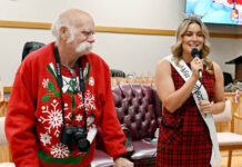 
			
				                                Dupont Borough councilman Bob Price looks on as Miss Northeastern PA, Victoria Vespico, addresses the audience assembled for Dupont’s Christmas celebration on Saturday, Dec. 14.
                                 Tony Callaio | For Sunday Dispatch

			
		