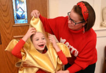 
			
				                                Second Presbyterian Church school instructor Amanda Thomas helps Delia Davis put on her star costume for the annual Christmas Program on Sunday, Dec. 15.
                                 Tony Callaio | For Sunday Dispatch

			
		